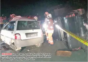  ??  ?? KEADAAN kenderaan Perodua Kancil dan Toyota Hilux yang bertembung dalam kejadian di Jalan Sandakan, Kampung Batu Putih.