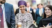  ?? J. SCOTT APPLEWHITE/AP ?? Freshman Democrats and liberal supporters came to the defense of Rep. Ilhan Omar, above center, which in part prompted House Speaker Nancy Pelosi to postpone action on a resolution.