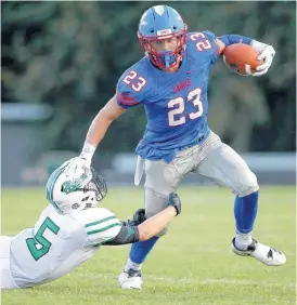  ?? [PHOTO BY BRYAN TERRY, THE OKLAHOMAN] ?? Jaxon Canard of Oklahoma Christian School gets past Trey Dorrell of Jones during Friday’s high school football game in Edmond.