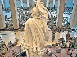  ?? AFP ?? Members of the National Guard rest inside the US Capitol in Washington, DC on Wednesday. They were deployed as part of tightening of security following the January 6 riot.