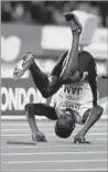  ?? Daniel Leal-Olivas AFP ?? USAIN BOLT takes a tumble after pulling up with a leg injury during the the anchor leg of the 400 relay.