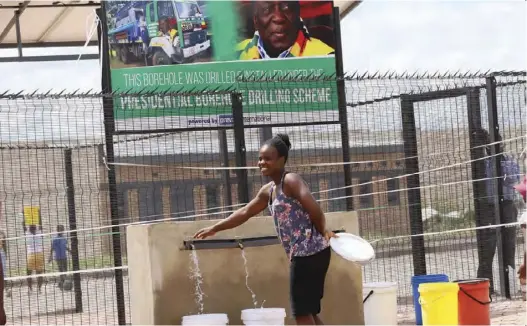  ?? Picture: Shepherd Tozvireva ?? A woman fetches water in St Mary’s, Chitungwiz­a yesterday at a borehole that was drilled under the presidenti­al scheme