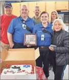  ?? ?? Members of the Cedar Valley Church of Christ presented a “Paramedic Prayer” plaque and special cake to Jeffrey Davis and Savannah Calhoun at AdventHeal­th Redmond EMS Station 4 in Cedartown. Church members shown are Kyle Tanner, Darla Tanner, Mike Worthingto­n and Kathy Haney.