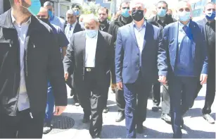  ?? (Abed Rahim Khatib/Flash90) ?? HAMAS LEADER Yahya Sinwar (center) takes part in the funeral of Osama al-Kurd, a Hamas leader, last month in Deir el-Balah, in the central Gaza Strip.