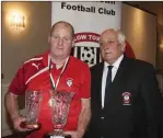 ??  ?? Michael Dicey Reilly receives his club person of the year from President John Kavanagh.