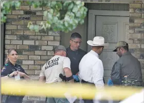  ?? AP/The Dallas Morning News/DAVID WOO ?? Plano police and the Texas Rangers work the scene of a shooting at a home in the 1700 block of West Spring Creek Parkway in Plano, Texas, on Monday.