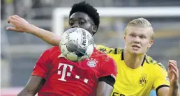  ?? DPA-BILD: Gambarini ?? Bayern in Front: Münchens Alphonso Davies (links) und Dortmunds Erling Haaland kämpfen um den Ball.