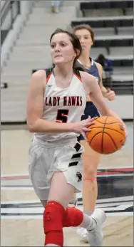  ?? TIMES photograph­s by Annette Beard ?? Senior Lady Blackhawk Aidan Dayberry started things off with a heady pass to a wide open senior Ravin Cawthon under the goal for a 2-0; Dayberry finished with 9 points Friday, Jan. 22.