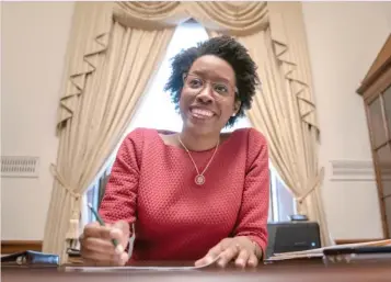  ?? J. SCOTT APPLEWHITE/AP ?? U.S. Rep. Lauren Underwood, D-Ill., works in her office on Capitol Hill last year.