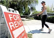  ?? Associated Press ?? ■ A woman walks next to a “For Rent” sign at an apartment complex July 19, 2006, in Palo Alto, Calif. Many tenants aren’t familiar with the ins and outs of their renters insurance policies, but what they don’t know could cost them money.