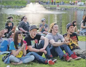  ?? DAVID JALA/CAPE BRETON POST ?? More than 1,000 people gathered around the south pond in Wentworth Park for the inaugural show of the Makin’ Waves concert series. Many concertgoe­rs opted for a comfortabl­e cushion of grass including, from left in the front row, Renee MacMullin, Michael Mullins, Liam Campbell and Jesse MacLeod.