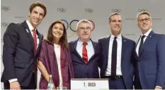  ?? — AFP ?? (L-R) Paris 2024 Co-Chairman Tony Estanguet, Paris Mayor Anne Hidalgo, Internatio­nal Olympic Committee (IOC) President Thomas Bach, Los Angeles Mayor Eric Garcetti and LA2028 Chairman Casey Wasserman pose for pictures after delivering a press message...