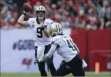  ?? JASON BEHNKEN — THE ASSOCIATED PRESS ?? Drew Brees and the Saints, who are the No. 1 seed in the NFC for the first time since 2009, will host the Eagles next Sunday.