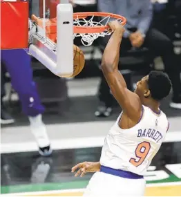  ?? AARON GASH AP ?? The Knicks’ RJ Barrett, who finished with 21 points, seven rebounds and seven assists, dunks during the first half Saturday against the Milwaukee Bucks.