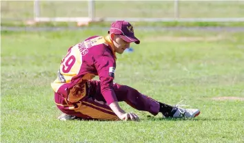  ?? ?? Cam Caddy slides to cut off runs during Neerim Districts second batting innings.