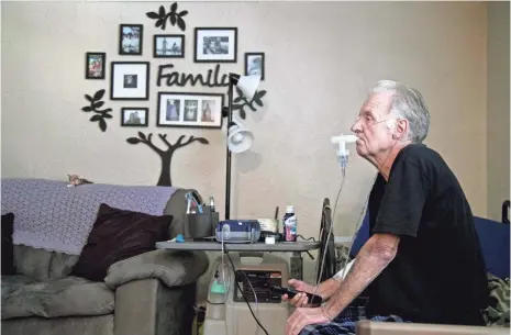  ?? PHOTOS BY AMANDA INSCORE, THE NEWS-PRESS ?? John Tagtmeir does a breathing treatment for his end-stage chronic obstructiv­e pulmonary disease. He and his wife had to move in with their daughter. He was receiving hospice care but was dropped when he lived past the six months allowed by Medicare.