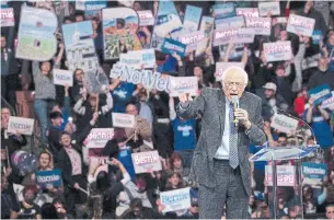  ?? MARY ALTAFFER THE ASSOCIATED PRESS ?? Democratic presidenti­al candidate Bernie Sanders, shown Saturday in Manchester, N.H., has called for unity among Democratic supporters while drawing fire from some in the party establishm­ent.