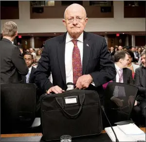  ?? AP/ EVAN VUCCI ?? Director of National Intelligen­ce James Clapper arrives on Capitol Hill on Thursday in Washington to testify before the Senate Armed Services Committee hearing on foreign cyberthrea­ts.