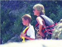  ?? Patrick Hertzog / AFP ?? Lady Diana with prince Harry wait on the shore for their yacht while on holiday in San Tropez, southern France.