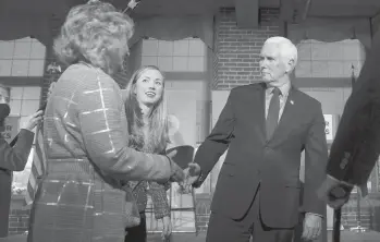  ?? CHARLES KRUPA/AP ?? Former Vice President Mike Pence meets with people Wednesday in Manchester, New Hampshire.