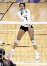  ?? Craig Moseley / Staff photograph­er ?? Nia McCardell (12) of Ridge Point digs a ball during the third set of the Classs 6A Region III final.