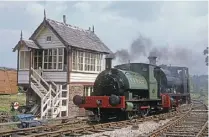  ?? ROBIN STEWARTSMITH ?? Robert Heath No. 6 and Peckett 0-4-0ST Lion (1351/1941) run past the signalbox at Caverswall Road, Foxfield Railway, during Lion’s first day in service on May 30, 1994. The Peckett has since moved to the Lincolnshi­re Wolds Railway.