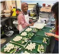  ??  ?? Doing what she does best: Zaleha preparing Malaysian fare in Bristol, Britain.