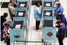  ?? ?? People fill out ballots in Las Vegas, Nevada, on 8 November 2022. Photograph: Anna Moneymaker/Getty Images