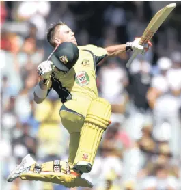  ?? PICTURE: REUTERS ?? JUMPING FOR JOY: David Warner celebrates reaching his hundred for Australia against Pakistan at the Adelaide Oval yesterday. Warner scored 179 as the home team romped to victory.