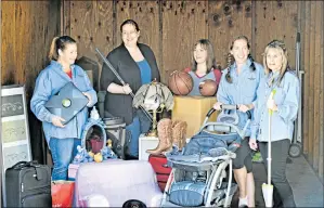  ?? PHOTO BYJOYCE GOLDSCHMID FOR BAY AREA NEWS GROUP ?? From left, members Heather Cressall, Leslie Brown, Kelly Sparrer, Erin Reuther and Corrine Fabie, president of the Junior League, organize an early dropoff Feb. 21 at a storage locker at the Santa Clara County Fairground­s.