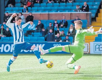  ?? ?? Kilmarnock’s Kyle Lafferty steers the ball past Jakub Stolarczyk to make it 1-0