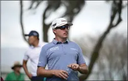  ?? The Associated Press ?? PGA PICKING BACK UP: Joel Dahmen walks down the 15th fairway after hitting his tee shot on March 8 during the final round of the Arnold Palmer Invitation­al golf tournament in Orlando, Fla. Dahmen is among PGA Tour players in the Scottsdale Open this week in Arizona.