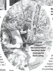  ??  ?? EDWIN (depan) bersama Nazri berjalan kaki menuju ke Gua Laing.