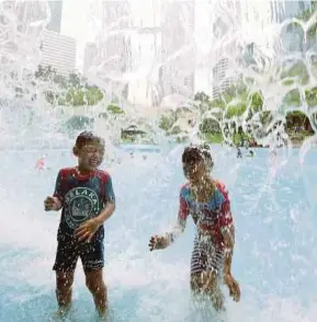  ??  ?? Children having a blast at the KLCC Park last month. Children develop best when surrounded by those who love them.