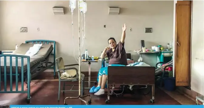  ??  ?? CARACAS: A woman gestures at a room of the University Hospital. — AFP