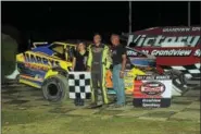  ?? RICK KEPNER - FOR DIGITAL FIRST MEDIA ?? Brett Kressley, pictured with his parents, celebrate in victory lane after Kressley’s first win of the season on June 17 at Grandview.