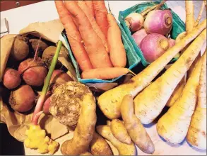  ?? Frank Whitman / For Hearst Connecticu­t Media ?? Turnips, parsnips, celeriac and rutabagas along with freshly dug potatoes and ginger from the Westport Farmers Market.
