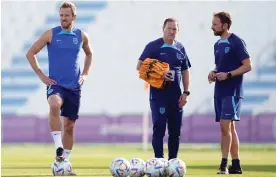  ?? Photograph: Mike Egerton/PA Images ?? Gareth Southgate (right), his No 2, Steve Holland (centre), and England’s captain, Harry Kane, plot a course to the World Cup semi-finals.