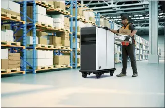  ?? GENERAL MOTORS VIA AP ?? The first product in General Motors’ new BrightDrop venture is this battery-powered wheeled pallet that will take goods from the warehouse to trucks and from trucks to destinatio­ns.