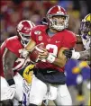  ?? TODD KIRKLAND / GETTY IMAGES ?? Quarterbac­k Tua Tagovailoa looks for a receiver under pressure during his 418-yard passing performanc­e for the Tide.