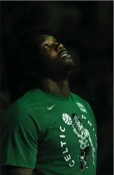  ?? ?? BANNER IN SIGHT: Robert Williams Iooks upwards toward the rafters during the playing of the National Anthem before Game 7 on Sunday.