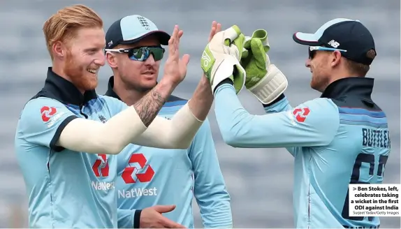  ?? Surjeet Yadav/Getty Images ?? Ben Stokes, left, celebrates taking a wicket in the first
ODI against India