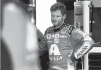  ?? AP Photo/Chuck Burton, File ?? n Dale Earnhardt Jr. watches crew members work on his car May 19 during practice for a NASCAR Cup series All-Star auto race at Charlotte Motor Speedway in Concord, N.C. Before Dale Earnhardt Jr. calls it a career and starts calling races for NBC, he'd...