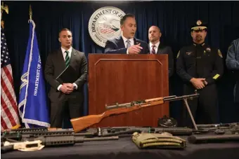  ?? FAITH NINIVAGGI PHOTOS / HERALD STAFF ?? ‘YOU’RE NOT WELCOME HERE’: Jason Molina, acting special agent in charge of Homeland Security investigat­ions in Boston, addresses the media about a major gun and drug bust in the Lawrence area on Friday. Below left, U.S. Attorney Andrew Lelling talks about the operation.