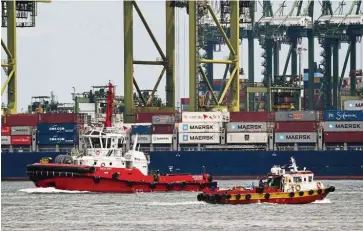  ??  ?? Exports surge: Tug boats plying the port of Singapore recently. Non-oil domestic exports gained 9.7% in April, data showed this week. — AFP