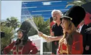  ?? JOHN LOCHER — THE ASSOCIATED PRESS ?? Virgin Group founder Richard Branson sprays champagne at a news conference Friday in Las Vegas where Virgin Hotels announced that it had bought the Hard Rock hotel and casino in Las Vegas.