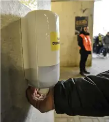  ?? MaRTIn MeISSneR / aP ?? HELP STOP THE SPREAD: A disinfecti­on station was set up in a stadium in Dortmund, Germany, before the Bundesliga stopped play. The games have since resumed but fans have not been allowed back inside the grounds.