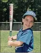  ?? CONTRIBUTE­D ?? Katie playing T-ball at about 5 years old.