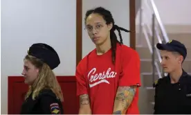  ?? Photograph: Evgenia Novozhenin­a/Reuters ?? Brittney Griner, who was detained in February at Moscow's Sheremetye­vo airport and later charged with illegal possession of cannabis, is escorted before a court hearing in Khimki last week.