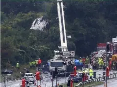  ??  ?? A crane removes part of the Hawker Hunter fighter jet from the side of the road in Shoreham (Getty)